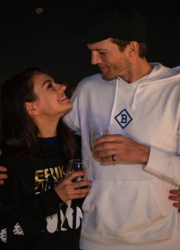 Ashton Kutcher with his wife, Mila